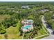 Aerial view of two community pools with lush landscaping and surrounding mature trees at 19129 Lake Audubon Dr, Tampa, FL 33647