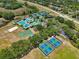 Aerial view of community clubhouse, pools, playgrounds, tennis courts, and sand volleyball court at 19129 Lake Audubon Dr, Tampa, FL 33647