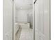 Bright bathroom features a soaking tub, glass enclosed shower, and tile flooring at 19129 Lake Audubon Dr, Tampa, FL 33647
