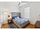 Bedroom featuring a modern bed frame, side table, lamp, and decorative rug at 19129 Lake Audubon Dr, Tampa, FL 33647