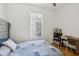 Bedroom features a desk, chair, and shelving adding functionality to this comfortable retreat at 19129 Lake Audubon Dr, Tampa, FL 33647