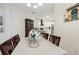 Bright dining area next to kitchen features a table with seating for six and lovely decor at 19129 Lake Audubon Dr, Tampa, FL 33647