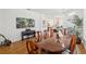 Elegant dining room featuring wood floors and a large wooden dining table at 19129 Lake Audubon Dr, Tampa, FL 33647