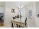 Cozy dining room with natural lighting, a decorative light fixture, and neutral walls at 19129 Lake Audubon Dr, Tampa, FL 33647