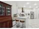 Modern kitchen with stainless steel appliances, white cabinetry, and granite counters provides a bright and inviting space at 19129 Lake Audubon Dr, Tampa, FL 33647