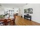 Open concept living spaces with hardwood floors, including a dining area and living room at 19129 Lake Audubon Dr, Tampa, FL 33647