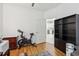 Home office space with wood floors and views to a kitchen at 19129 Lake Audubon Dr, Tampa, FL 33647