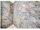 Luxurious walk-in shower with stunning marble tile and sleek fixtures at 20 Windrush Bay Dr, Tarpon Springs, FL 34689
