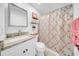 Bathroom featuring marble sink and countertop, with a decorative shower curtain at 20 Windrush Bay Dr, Tarpon Springs, FL 34689
