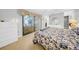 Cozy bedroom with tile flooring, natural light and a sliding glass door at 20 Windrush Bay Dr # 20, Tarpon Springs, FL 34689