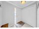 Welcoming foyer with neutral tones, coat closet and tile floors at 20 Windrush Bay Dr # 20, Tarpon Springs, FL 34689