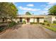 Charming single-story home with a well-manicured front yard and ample parking at 20 Windrush Bay Dr # 20, Tarpon Springs, FL 34689