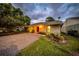 Front yard with well-maintained lawn and landscaping around the house's exterior at 20 Windrush Bay Dr # 20, Tarpon Springs, FL 34689