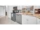 Well-equipped kitchen featuring stainless steel appliances, and granite countertops at 20 Windrush Bay Dr # 20, Tarpon Springs, FL 34689