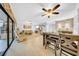 Bright living room with adjacent dining area and access to patio at 20 Windrush Bay Dr # 20, Tarpon Springs, FL 34689
