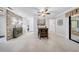 Open floor plan with tile flooring, an accent wall, and natural light creating a welcoming atmosphere at 20 Windrush Bay Dr # 20, Tarpon Springs, FL 34689