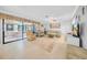 Spacious living room with sliding glass doors and a comfortable seating area at 20 Windrush Bay Dr # 20, Tarpon Springs, FL 34689