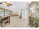 Open-concept living area with exposed stone wall and plenty of natural light at 20 Windrush Bay Dr # 20, Tarpon Springs, FL 34689