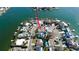 Waterfront home with dock, lush landscaping, and boat lift, offering stunning views and convenient boating access at 2015 Dolphin S Blvd, St Petersburg, FL 33707
