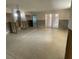 Spacious basement features concrete floors, exposed structure, and sliding glass doors at 2015 Dolphin S Blvd, St Petersburg, FL 33707
