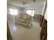 Bright bedroom space featuring a concrete floor, with two large windows and natural lighting at 2015 Dolphin S Blvd, St Petersburg, FL 33707