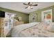 Cozy main bedroom with neutral carpet and access to a patio at 2153 Catalina N Dr, Clearwater, FL 33763
