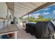 Covered patio with plenty of room for grilling and entertaining near the pool at 2153 Catalina N Dr, Clearwater, FL 33763