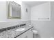 Elegant bathroom features granite countertops, a modern sink, and tiled accents at 2286 Norwegian Dr # 8, Clearwater, FL 33763