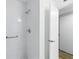 Clean shower with modern fixtures, grab bar, and a sleek glass door at 2286 Norwegian Dr # 8, Clearwater, FL 33763