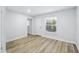 A bright bedroom with wood floors, neutral paint and ample natural light at 2286 Norwegian Dr # 8, Clearwater, FL 33763