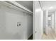 View of the walk-in closet with hanging rods and storage shelves at 2286 Norwegian Dr # 8, Clearwater, FL 33763