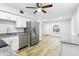 Updated kitchen featuring granite countertops, stainless appliances and wood look floors at 2286 Norwegian Dr # 8, Clearwater, FL 33763