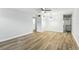 Bright living room featuring ceiling fan and sleek, wood-look flooring at 2286 Norwegian Dr # 8, Clearwater, FL 33763
