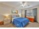 Bedroom with ample natural light features soft carpet, coordinated decor, and a relaxing ambiance at 2400 Winding Creek Blvd # 24-102, Clearwater, FL 33761