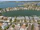 Aerial view of waterfront community and the adjacent bay, showcasing the real estate's prime location at 2511 Bay Blvd # B, Indian Rocks Beach, FL 33785