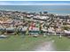 Aerial view of waterfront property featuring private docks, pools, and coastal charm at 2511 Bay Blvd # B, Indian Rocks Beach, FL 33785