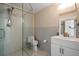 Modern bathroom features sleek glass-door shower, vanity, and tiled walls at 2511 Bay Blvd # B, Indian Rocks Beach, FL 33785
