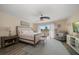 Inviting bedroom with a comfortable bed, seating, and access to a balcony for enjoying the view at 2511 Bay Blvd # B, Indian Rocks Beach, FL 33785