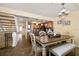 Dining area connecting to kitchen with seating and staircase nearby at 2511 Bay Blvd # B, Indian Rocks Beach, FL 33785
