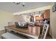 Dining room with a farmhouse style dining set and kitchen access at 2511 Bay Blvd # B, Indian Rocks Beach, FL 33785