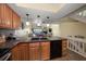 Open kitchen with granite countertops, stainless steel appliances, and bar seating at 2511 Bay Blvd # B, Indian Rocks Beach, FL 33785