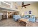 Open-concept living area with high ceilings and beach-themed decor at 2511 Bay Blvd # B, Indian Rocks Beach, FL 33785