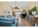Spacious living room with balcony views, fireplace, and coastal-inspired design at 2511 Bay Blvd # B, Indian Rocks Beach, FL 33785