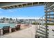 Outdoor pool area with waterfront access and spiral staircase, perfect for entertaining or relaxation at 2511 Bay Blvd # B, Indian Rocks Beach, FL 33785