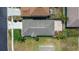 Aerial view of the home showing the roof and backyard paver patio at 25830 Crippen Dr, Land O Lakes, FL 34639