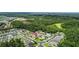 Aerial view of home in a well-established neighborhood, close to lake and pond at 25830 Crippen Dr, Land O Lakes, FL 34639