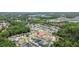 Neighborhood aerial view with the house pinpointed, surrounded by trees, roads, and other homes at 25830 Crippen Dr, Land O Lakes, FL 34639