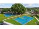 View of two basketball courts in the community featuring a green surface and mature shade trees at 25830 Crippen Dr, Land O Lakes, FL 34639