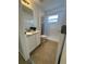 This cozy bathroom has a shower/tub, and a cabinet with a sink at 25830 Crippen Dr, Land O Lakes, FL 34639
