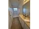 Functional bathroom features a walk-in shower, vanity, and tile flooring at 25830 Crippen Dr, Land O Lakes, FL 34639